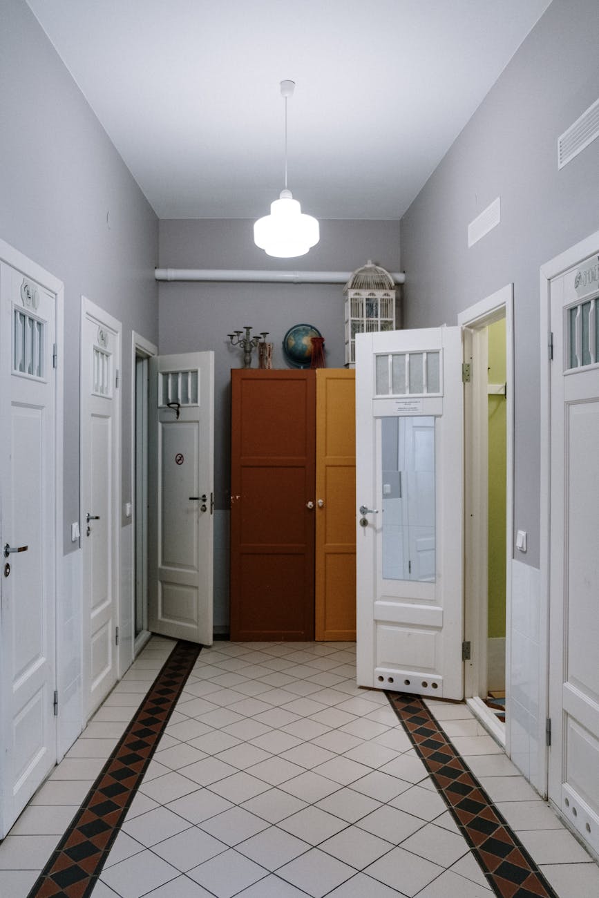 Bright minimalist apartment interior with multi-level lighting and hidden storage