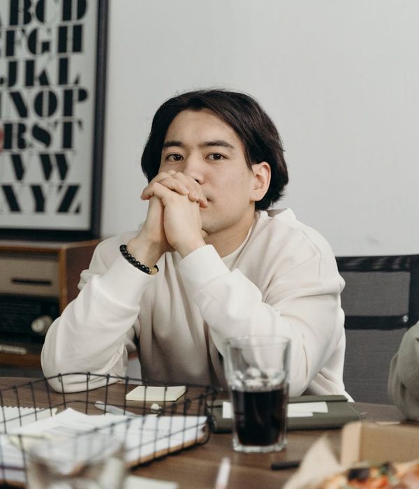 Professional man lighting designer planning illumination in modern studio